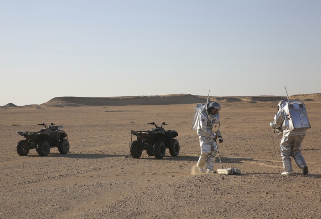 Scientists test space suits and a geo-radar, above, for use in a future Mars mission in the Dhofar desert of southern Oman. At left, Gernot Groemer, commander of the AMADEE-18 Mars simulation, stands among the inflated buildings of the Oman Mars Base.