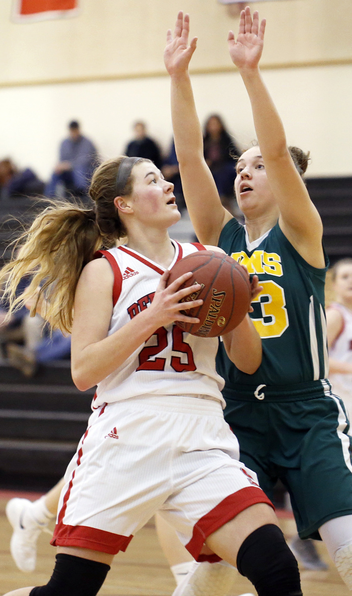 Sophie Glidden, who finished with 13 points, looks to shoot while defended by Serena Mower of Maine Girls' Academy.