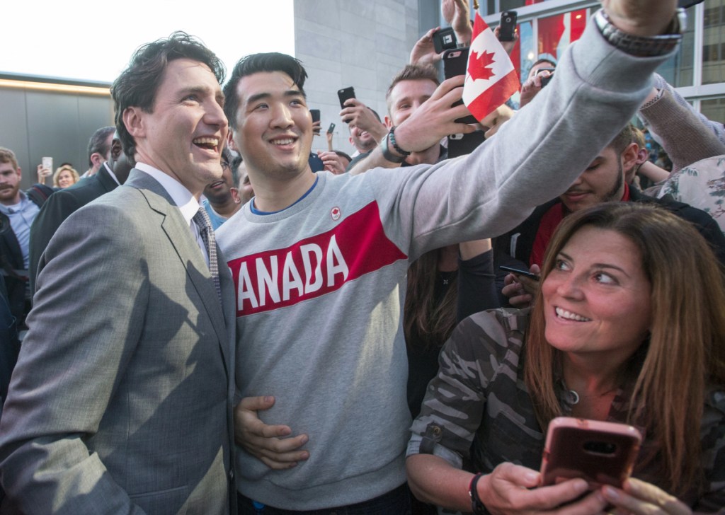 Canadian Prime Minister Justin Trudeau poses with employees as he leaves the offices of Salesforce on Thursday in San Francisco. It was the state leader's first official visit to California's tech-industry hub.