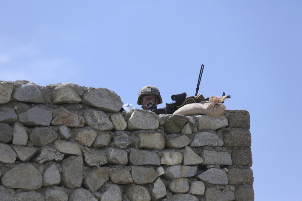 A U.S. soldier stands guard in the Achin district of Jalalabad, Afghanistan, last year. The U.S. military is expanding its efforts toward the eastern border, where the Taliban has commingled with ethnic Uyghur militants.