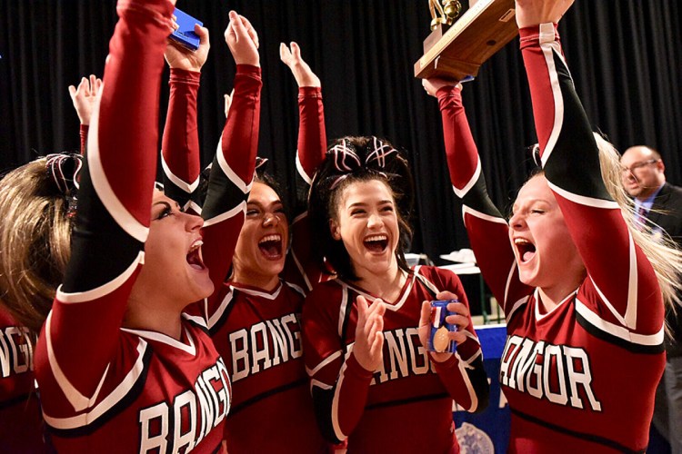 Bangor cheerleaders celebrate their victory Saturday in the Class A state championships at Cross Insurance Center. (Andree Kehn/Sun Journal)