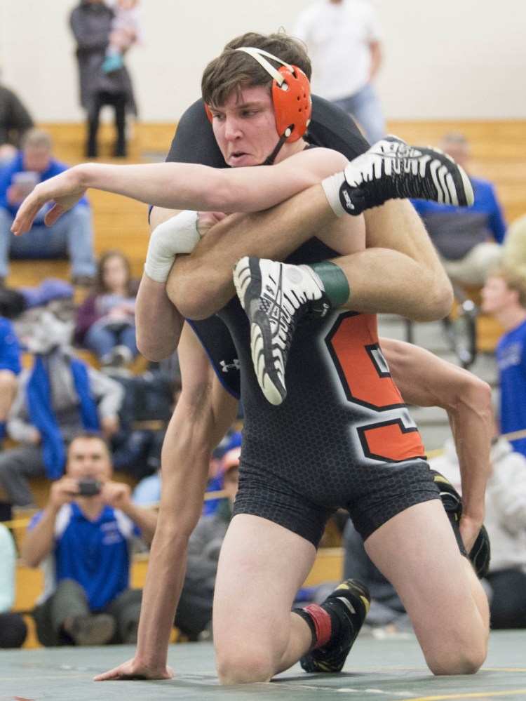 Chandler Shaw of Skowhegan tries to flip Caden Kowalsky of Mt. Ararat in a 138-pound match at the Class A North wrestling championships Saturday. Kowalsky came back to claim the regional title.