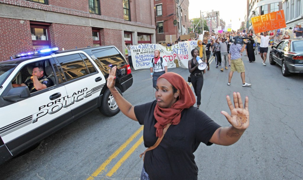 Shadiyo Hussain chants "Hands up, don't shoot!" in 2016 during a march to a Black Lives Matter event in Portland. Asked to face up to our nation's endemic racism, white Americans often react as if the request is personal.