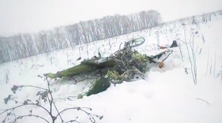 The wreckage of an An-148 plane is seen in Stepanovskoye village, about 25 miles from the Domodedovo airport in Russia on Sunday. Russia's Emergencies Ministry said the passenger plane crashed near Moscow, killing all 71 people aboard.