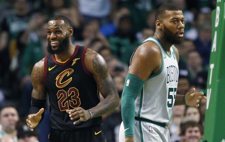 Cleveland's LeBron James reacts to a call as Boston's Greg Monroe turns away during the Celtics' 121-99 loss on Sunday in Boston.