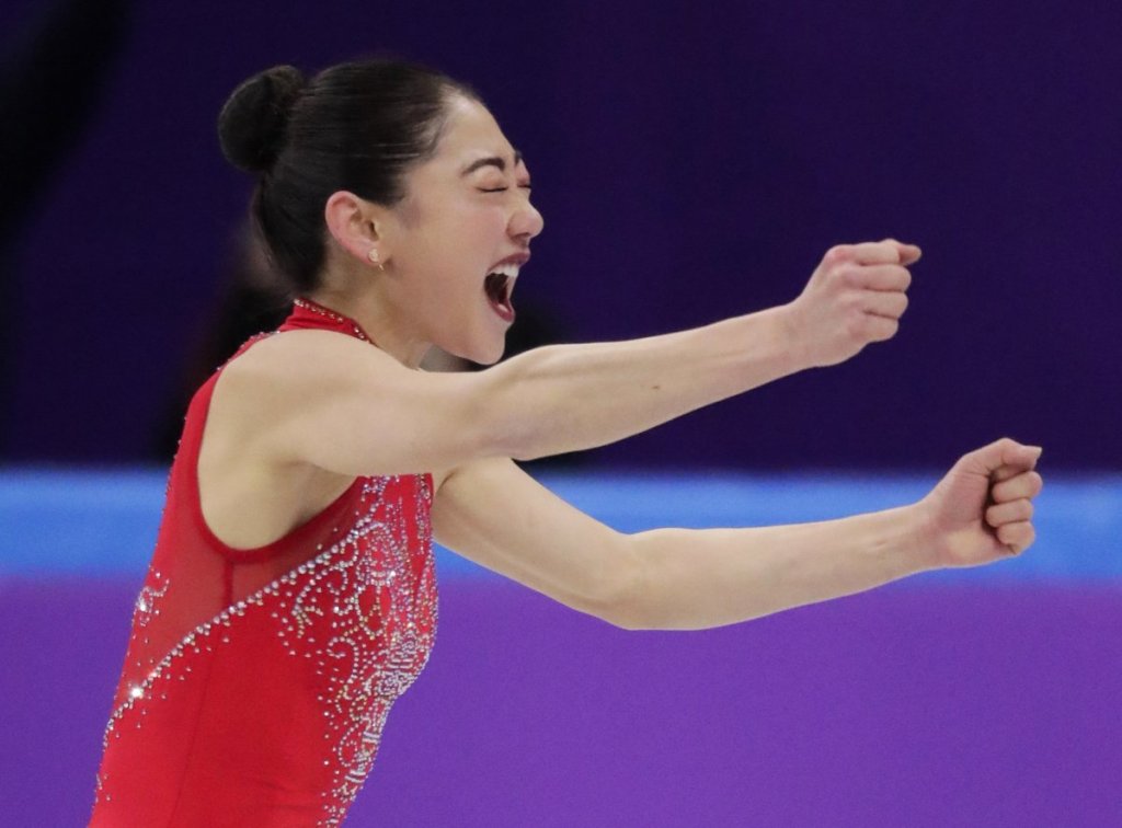 Mirai Nagasu of the United States reacts after she landed a triple axel.