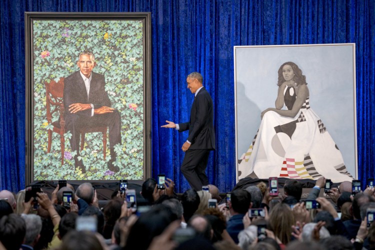 Former President Barack Obama takes the stage during the unveiling of the official Obama portraits at the Smithsonian's National Portrait Gallery on Monday in Washington.
