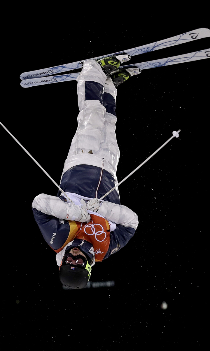 Troy Murphy, of the United States, jumps during the first round of men's moguls finals Monday at Phoenix Snow Park at the 2018 Winter Olympics in PyeongChang, South Korea. Murphy, of Bethel, scored 72.72 and did not advance to the second round. Story, D5