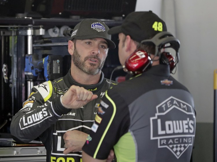 Jimmie Johnson, left, with crew chief Chad Knaus, signed a three-year extension with Hendrick Motorsports and sees no reason why he can't win a title each of those three seasons.