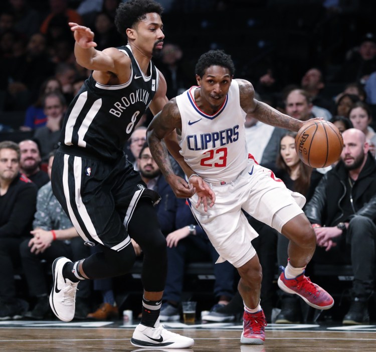 Clippers guard Lou Williams tries to drive past Nets guard Spencer Dinwiddie during the Clippers' 114-101 win Monday in New York. Williams scored 20 points off the bench.