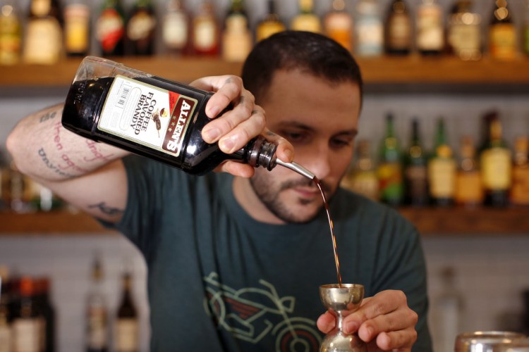 Jaren Rivas makes what he calls a "Woo Carré" – a riff on a New Orleans specialty, the Vieux Carré – with Allen's Coffee Flavored Brandy, rum, sweet vermouth, bitters and more.