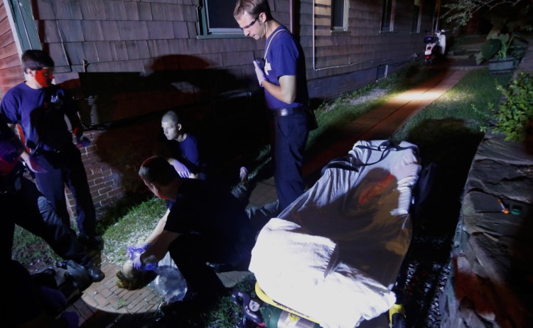 Portland paramedics respond to a 2015 overdose report before reviving an unconscious woman. 