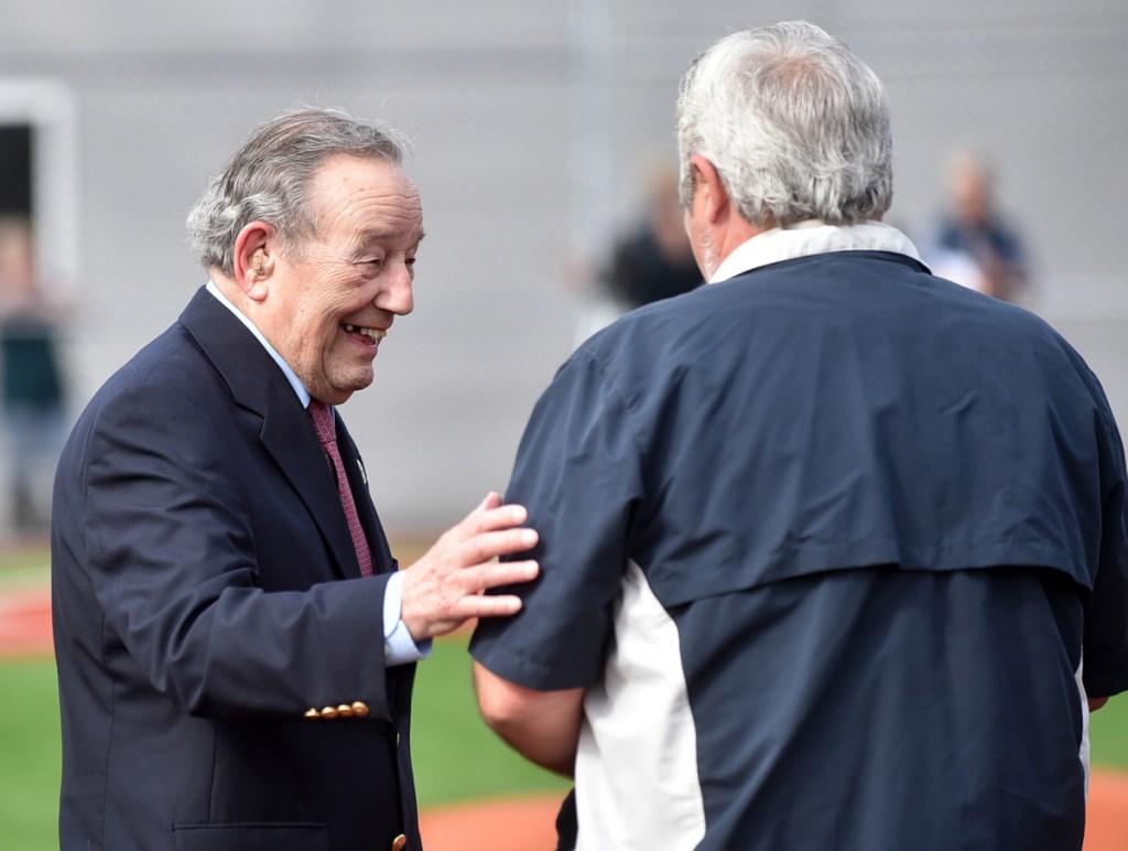 Paul Mitchell greets people after being introduced during the dedication of Purnell Wrigley Field in Waterville on April 29, 2017. The third base side dugout is named after him.