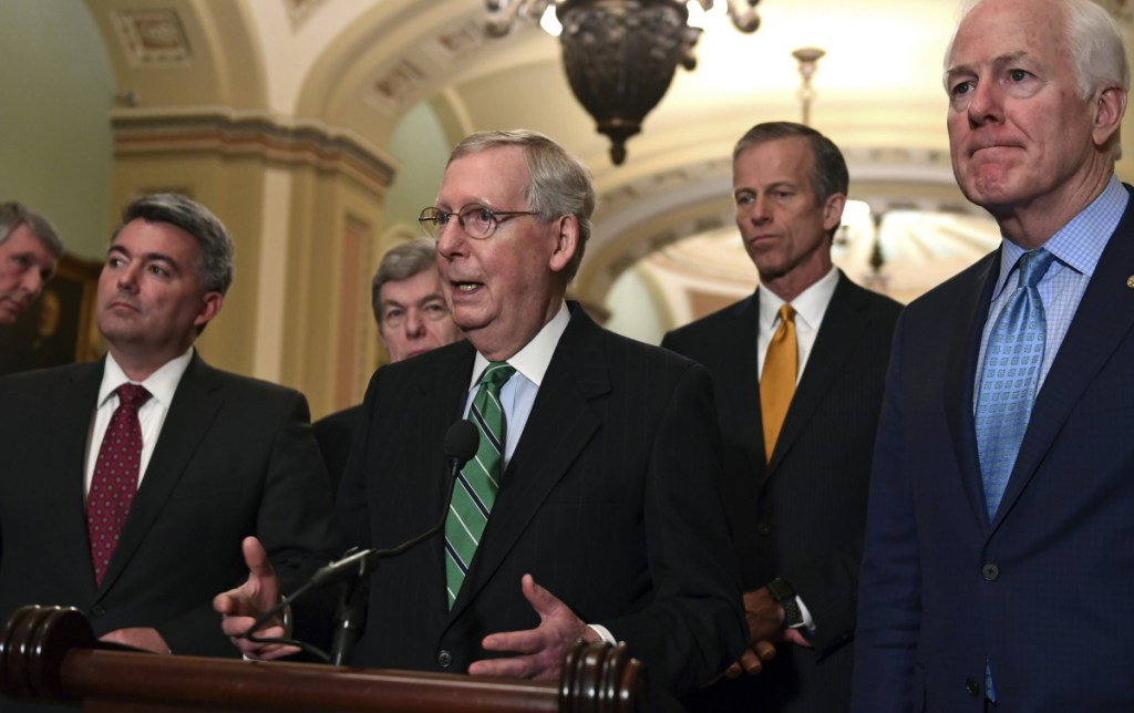 Senate Majority Leader Mitch McConnell of Ky., center, with other members of his party at the Capitol on Tuesday, discusses prospects for agreement on an immigration bill.