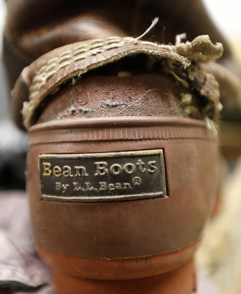 L.L. Bean says it will always accept retuns on products that have failed, such as this boot in the company's return bin in Freeport.
