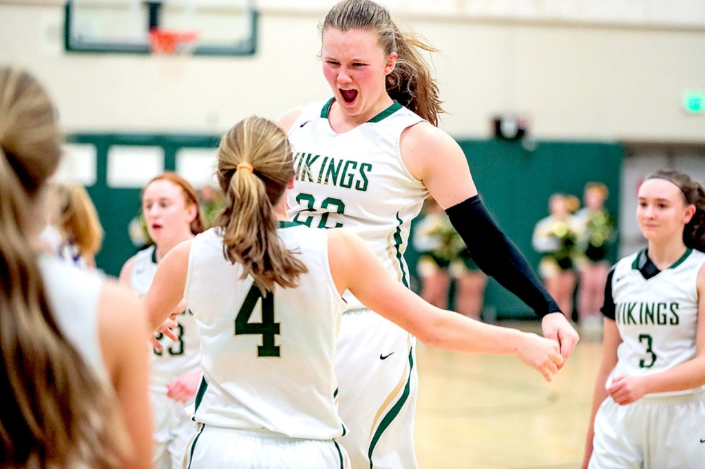 Oxford Hills junior Jadah Adams, right, celebrates with Emily Corbett after the Vikings defeated Deering 55-40 in Paris on Thursday.