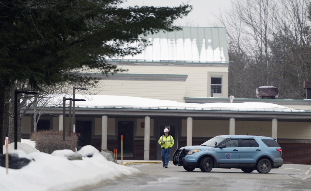 A Maine State Police cruiser is parked outside Woodside Elementary School in Topsham following a threat Friday. Authorities later declared the school secure.