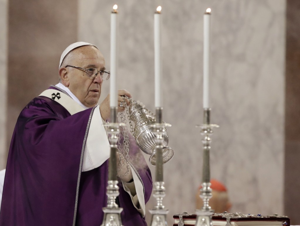Pope Francis celebrates Mass at the Basilica of Saint Sabina in Rome Wednesday, Feb. 14, 2018. Pope Francis is marking Ash Wednesday with prayer and a solemn procession between two churches on one of ancient Rome's seven hills. (AP Photo/Alessandra Tarantino)