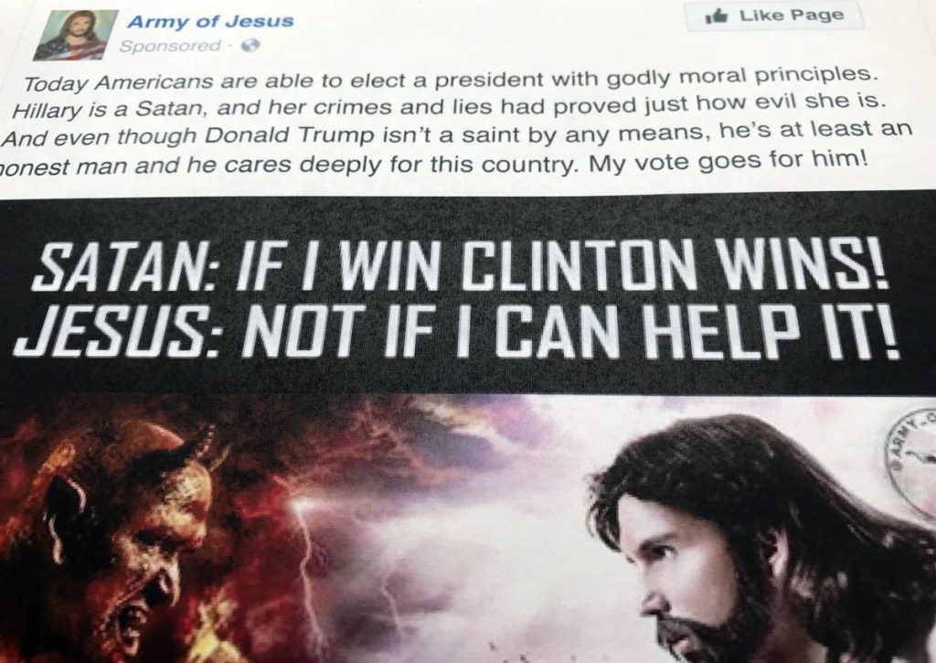 A Facebook ad linked to a Russian effort to disrupt the American political process and stir up tensions around divisive social issues, released by the U.S. House Intelligence Committee, is photographed in Washington, on Friday, Feb. 16, 2018. The ad, with the words "Hillary is a Satan, and her crimes and lies had proved just how evil she is" was listed as an excerpt of political advertising in the indictment charging 13 Russians and three Russian entities in an elaborate plot to interfere in the 2016 U.S. presidential election (AP Photo/Jon Elswick)