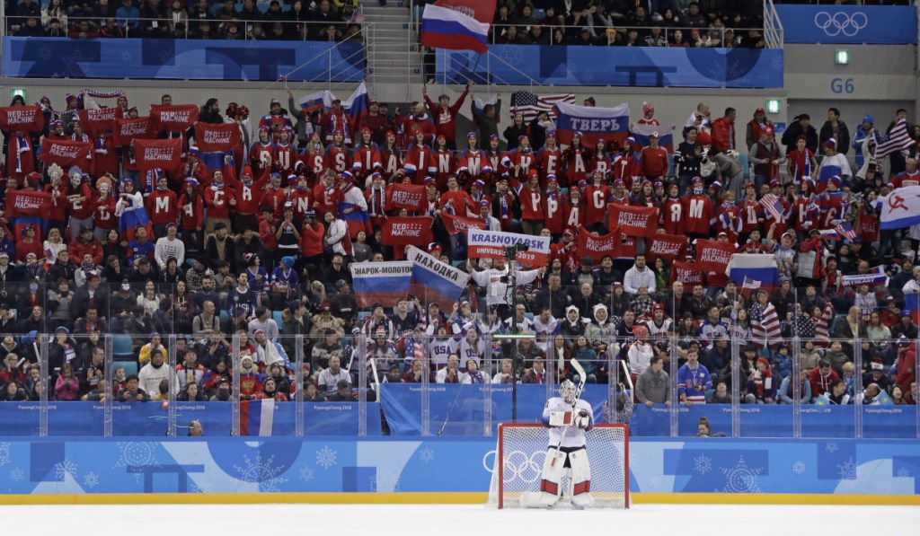 Supporters of Russian athletes cheer as goalie Ryan Zapolski of the United States waits during the first period at the 2018 Winter Olympics in Gangneung, South Korea on Saturday. The team from Russia won, 4-0.