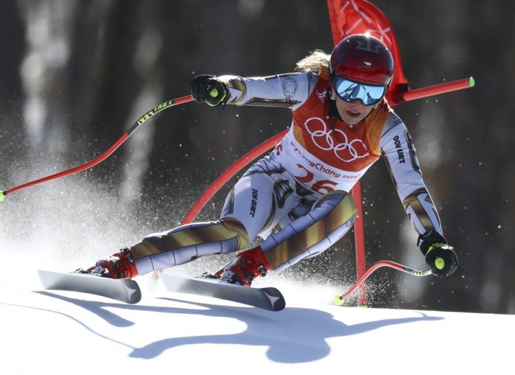 Ester Ledecka kept waiting for her time to change after finishing her final run in the super-G at the Winter Olympics on Saturday. It never did and Ledecka, a snowboarder by trade, won skiing gold.