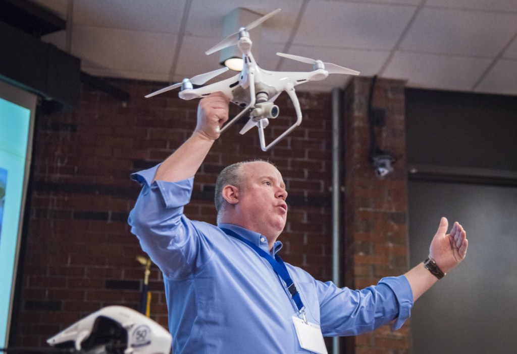David Price, of the Association of Professional Drone Pilots, presents at the first drone business applications conference at the University of Maine in Augusta.