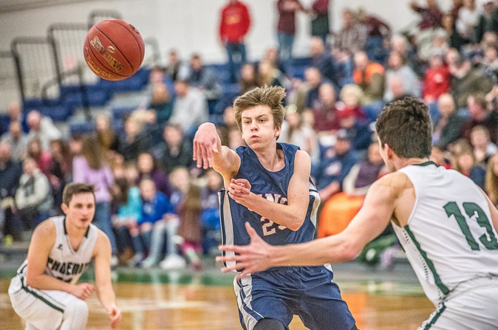 Zack Pomerleau, who hit three 3-pointers and finished with 12 points for Gray-New Gloucester, finds room to pass between Mason Shink, left, and Nick Lombardi of Spruce Mountain during Gray-New Gloucester's 57-34 victory Saturday in a Class B South quarterfinal at the Portland Expo.