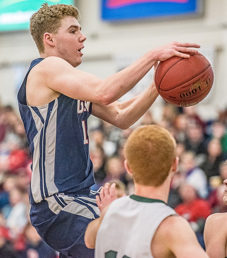 John Martin heads down the lane to take a shot for Gray-New Gloucester against Spruce Mountain. The Patriots will take on top-ranked Wells in the semifinals Thursday night.