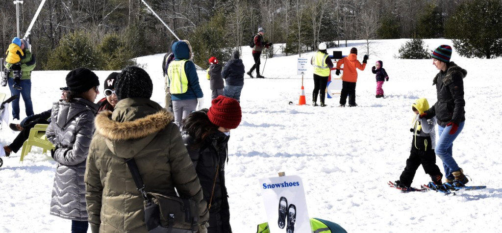Families try cross-country skiing, snowshoes, sledding and games during the Winter Fun Day at the Quarry Road Recreation Area in Waterville on Sunday.