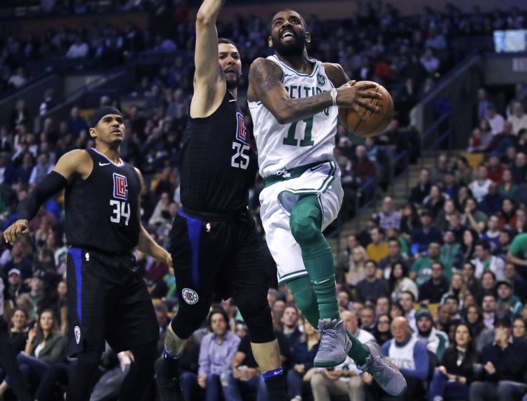 Kyrie Irving, right, drives to the hoop during the Celtics' 129-119 loss to the Clippers on Wednesday. Boston is just 5-4 since facing the Golden State Warriors on Jan. 27.