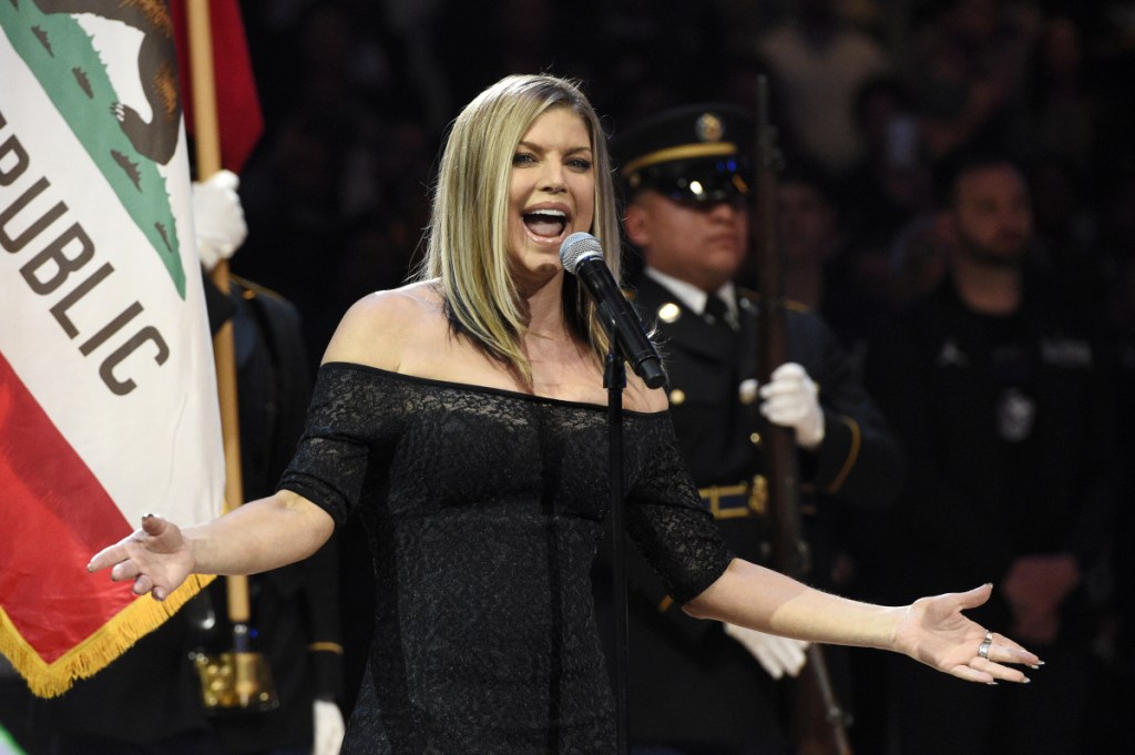 Fergie performs the national anthem before the start of the NBA All-Star basketball game in Los Angeles on Sunday.