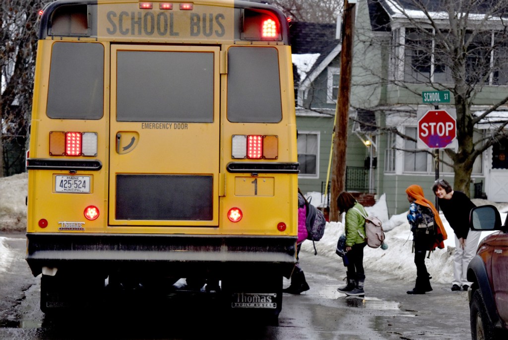 Albert S. Hall elementary students board a bus in Waterville. On Feb. 7, police received a report of a registered sex offender walking near the school and police arrested him on a probation violation charge because he was prohibited from being around the school.
