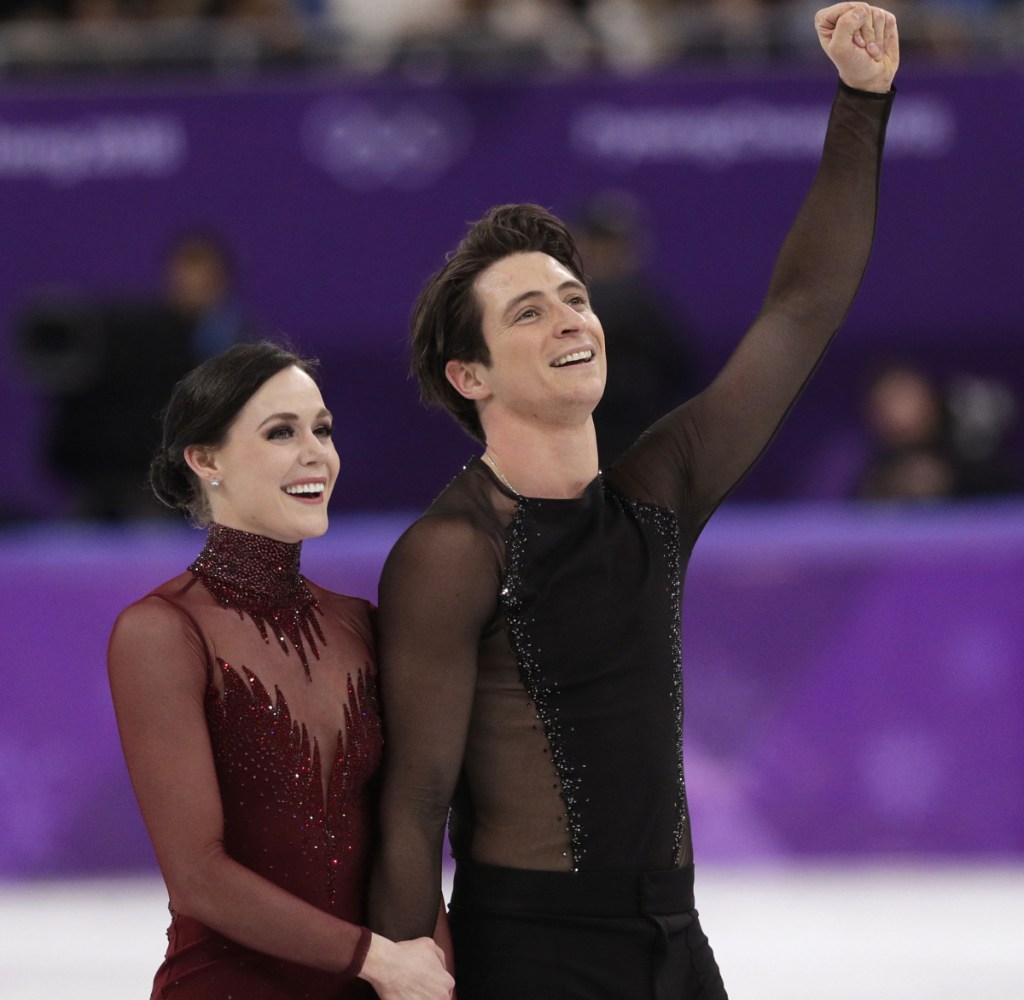 Tessa Virtue and Scott Moir of Canada react as they leave the ice following their performance in the ice dance, free skate final Tuesday. Virue and Moir won the gold in their final Olympic performance.