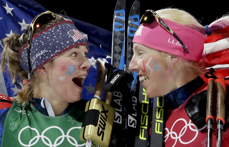 Jessica Diggins, left, and Kikkan Randall of Team USA celebrate after winning the gold medal in the women's team sprint freestyle cross-country skiing on Wednesday.