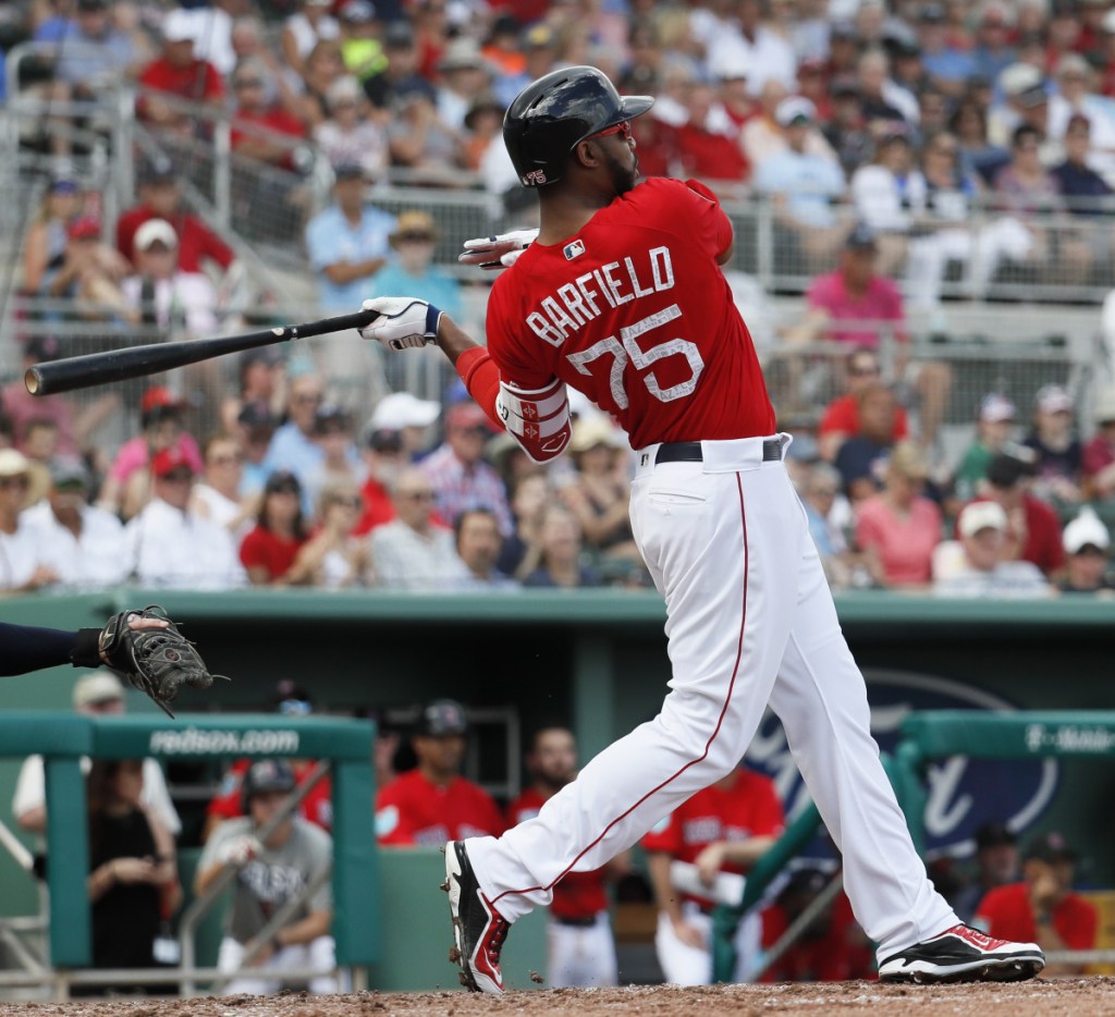 Jeremy Barfield of the Red Sox hits a two-run double in the fourth inning Friday against the Minnesota Twins, sparking Boston to a 4-3 win in its exhibition opener.