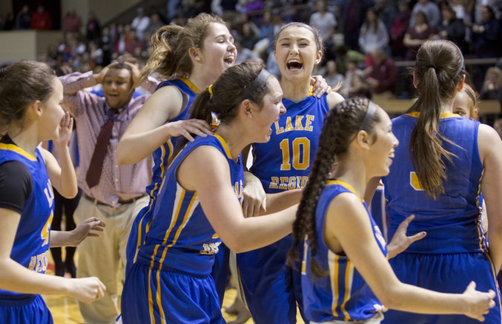 Lake Region senior Melissa Bonenfant, 10, celebrates with teammates after the Lakers' 42-34 win over Freeport in the Class B South final.
