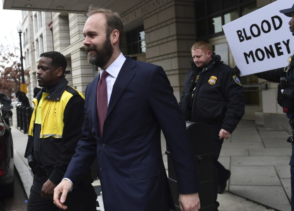Rick Gates leaves federal court in Washington on Friday. Gates will face an estimated 57 to 71 months in prison.