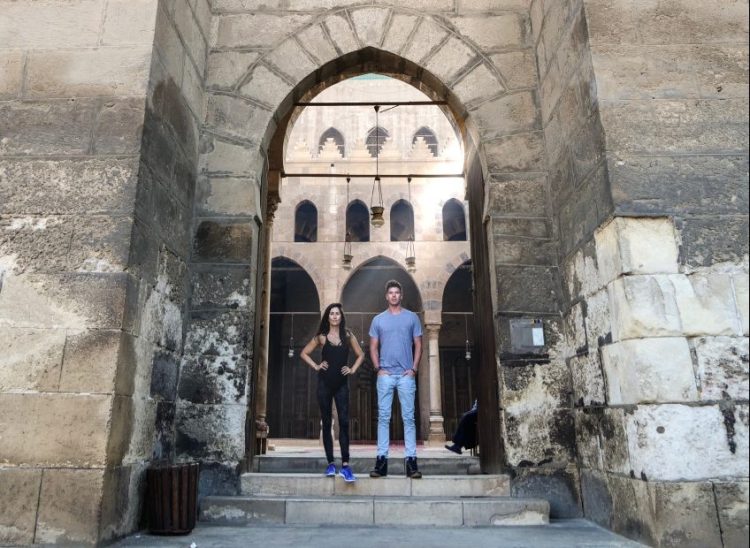 Julie Berry and Kasey Stewart stand at the entrance of an ancient citadel in Cairo, Egypt.