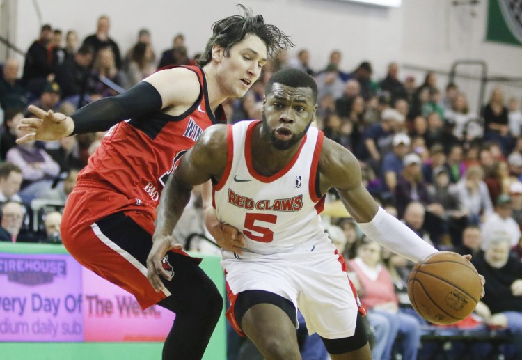 Maine's Kadeem Allen drives around Windy City's Ryan Arcidiacono in first half of the Red Claws 112-109 win Sunday at the Portland Expo.