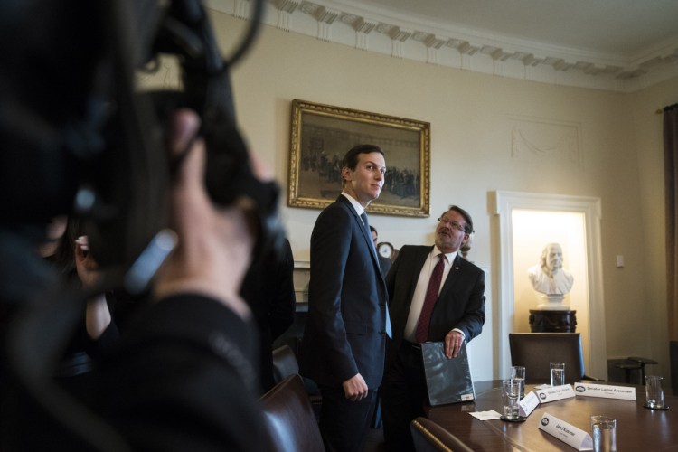 Jared Kushner stands after President Trump spoke at a meeting with lawmakers about trade policy Tuesday at the White House. Kushner's contacts with foreign government officials have raised concerns inside the White House and are a reason his interim security clearance was downgraded from the top-secret to secret.
