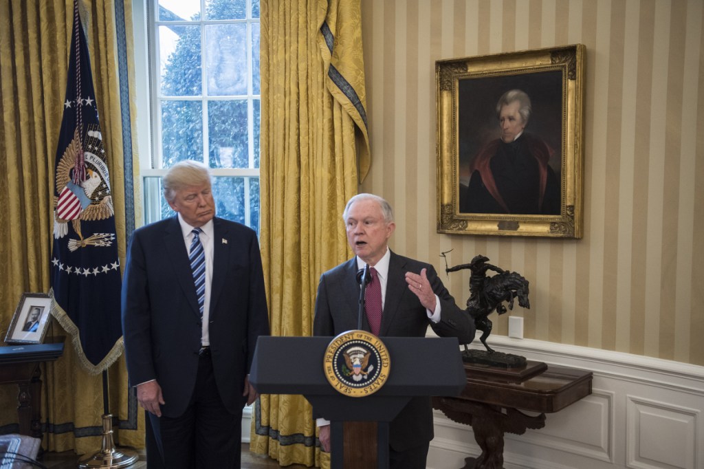 President Trump with Attorney General Jeff Sessions at the White House on Feb. 9.  Sessions insists he will not resign.