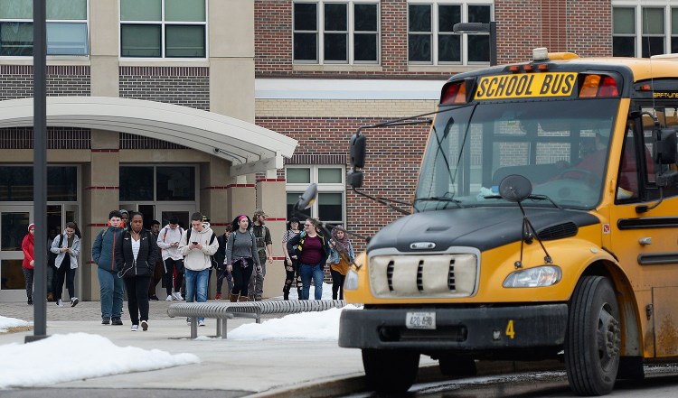 Students leave South Portland High School at the end of the school day Thursday. A student was arrested in the morning on a charge of terrorizing after allegedly posting a social media message about "shooting up the school."