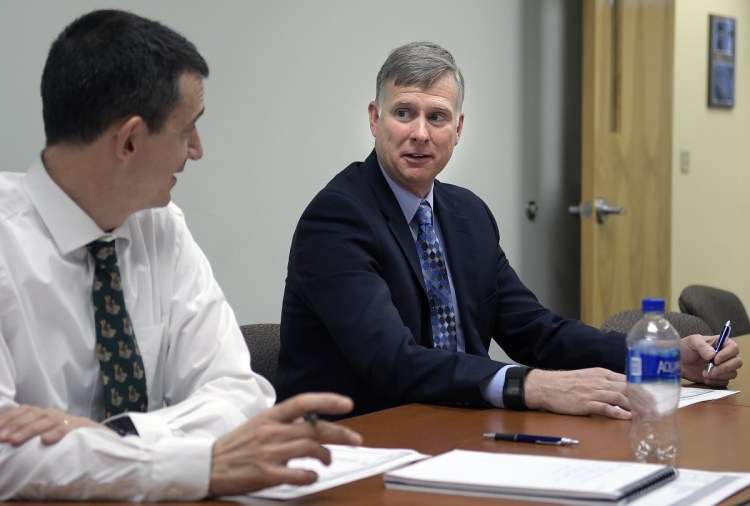 Maine State Police Col. Robert Williams, right, attending a meeting at his office at the Department of Public Safety in Augusta with Lt. Col John Cote, announced Tuesday that he's retiring to assume the position of security director at Colby College in Waterville.