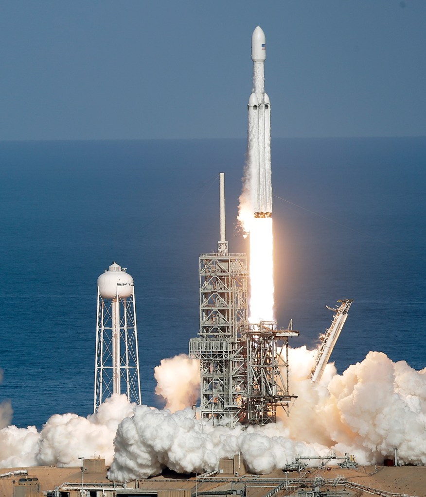 A Falcon 9 SpaceX Heavy rocket lifts off from pad 39A at the Kennedy Space Center in Cape Canaveral, Florida, on Tuesday. The Falcon Heavy has three first-stage boosters, strapped together with 27 engines in all.