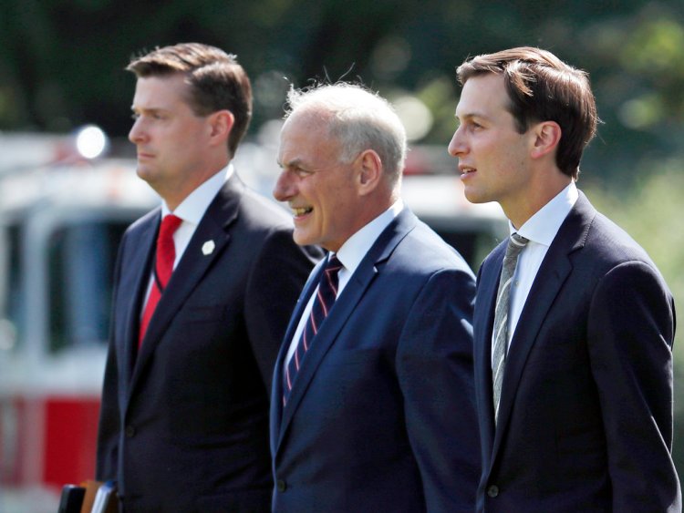 Then-White House staff secretary Rob Porter, left, White House Chief of Staff John Kelly, and White House senior adviser Jared Kushner walk to Marine One on the South Lawn of the White House on Aug. 4, 2017. 
