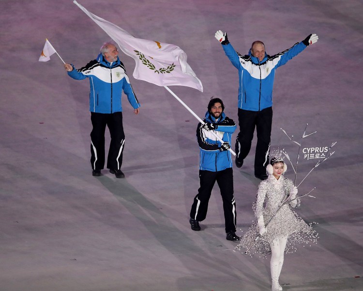 Dinos Lefkaritis carries the flag of Cyprus during the opening ceremony of the 2018 Winter Olympics in Pyeongchang, South Korea, on Friday.