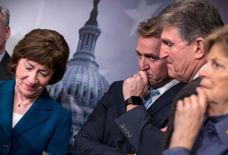 From left, Sen. Susan Collins, R-Maine, Sen. Jeff Flake, R-Ariz., Sen. Joe Manchin, D-W.Va., and Sen. Jeanne Shaheen, D-N.H., finish a news conference on the bipartisan immigration deal they reached, at the Capitol in Washington on Thursday. The plan was rejected, as was a Republican plan promoted by President Trump.