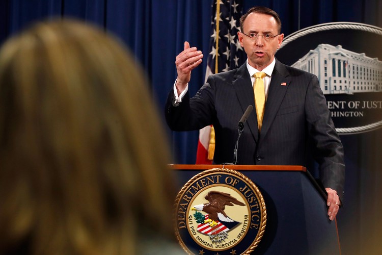 Deputy Attorney General Rod Rosenstein answers a question Friday after the office of special counsel Robert Mueller announced a grand jury has charged 13 Russian nationals and several Russian entities with an elaborate plot to interfere in the 2016 U.S. presidential election. 