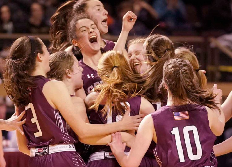Greely girls celebrate their victory over Brunswick in the Class A South regional final at the Cross Insurance Arena in Portland on Saturday, February 24, 2018. Staff Photo by Gregory Rec