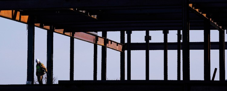 A worker with Cianbro works on the second floor of an office building under construction on Monday, January 29, 2018 on the Portland waterfront. Staff Photo by Gregory Rec